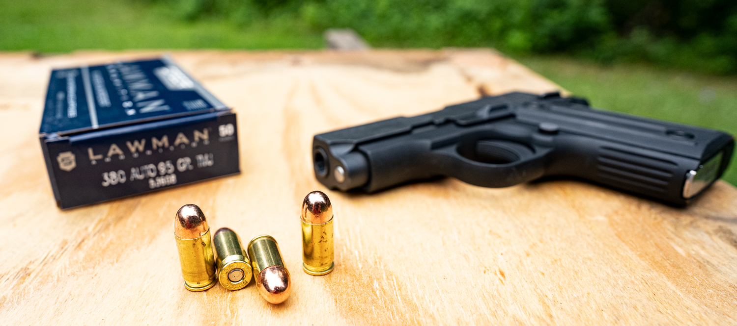 380 ACP ammo and pistol at a shooting range