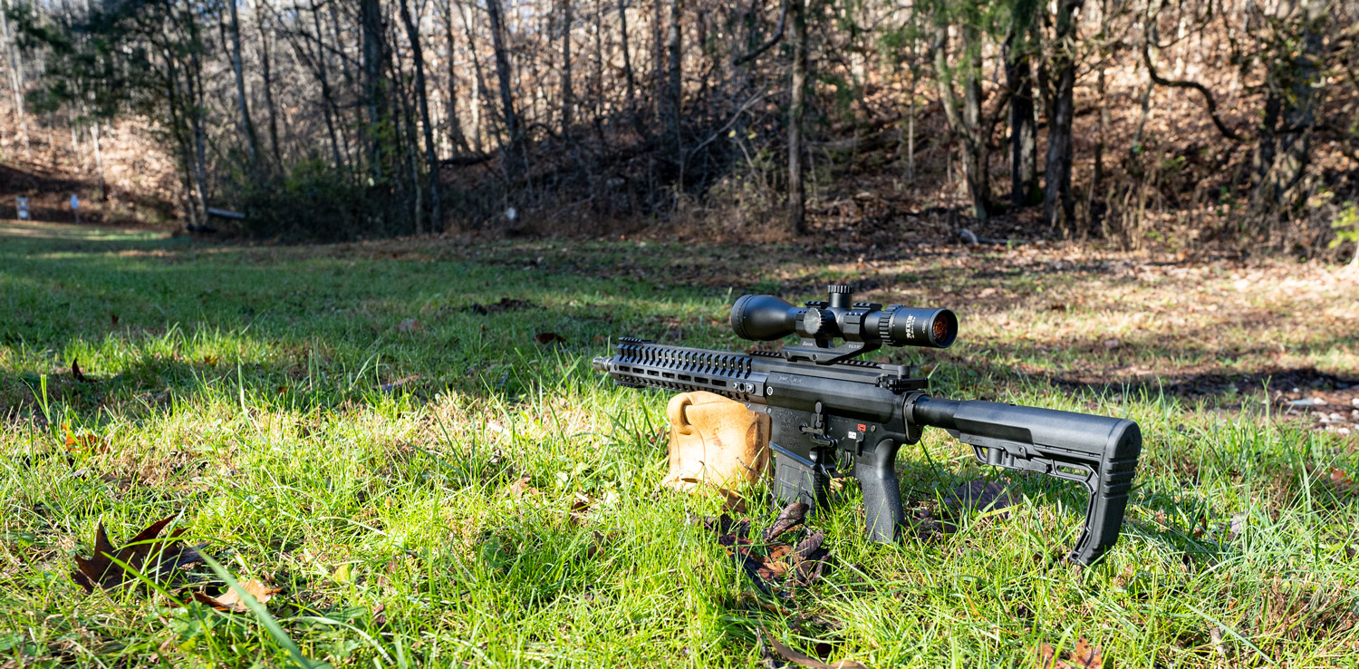 A 6.5 creedmoor rifle pointed downrange at a shooting range