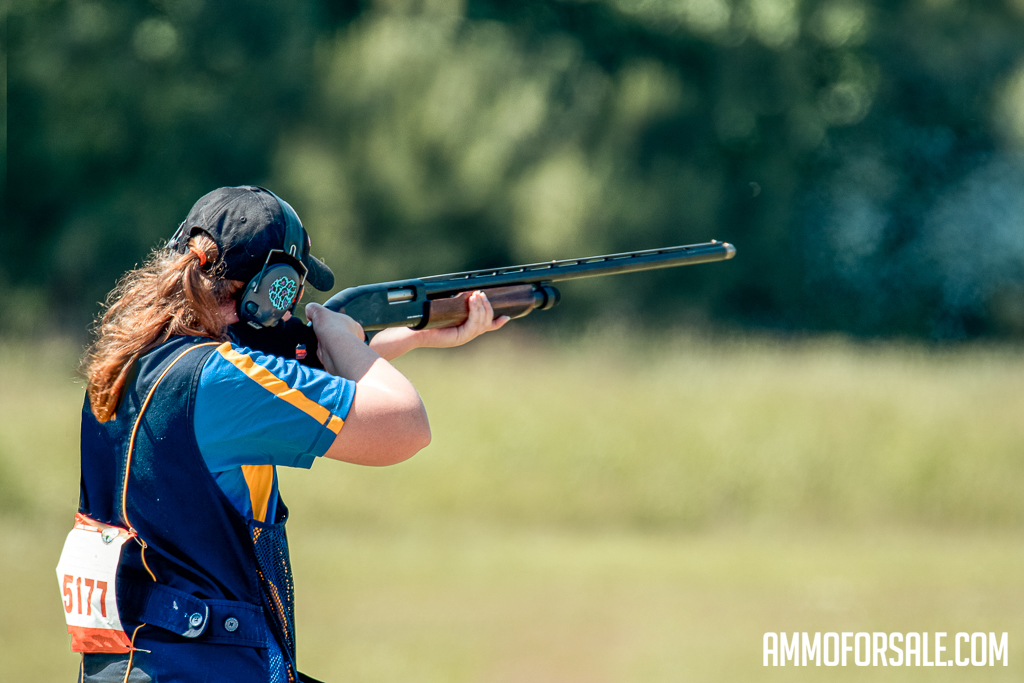 A woman shooting clays during a competition