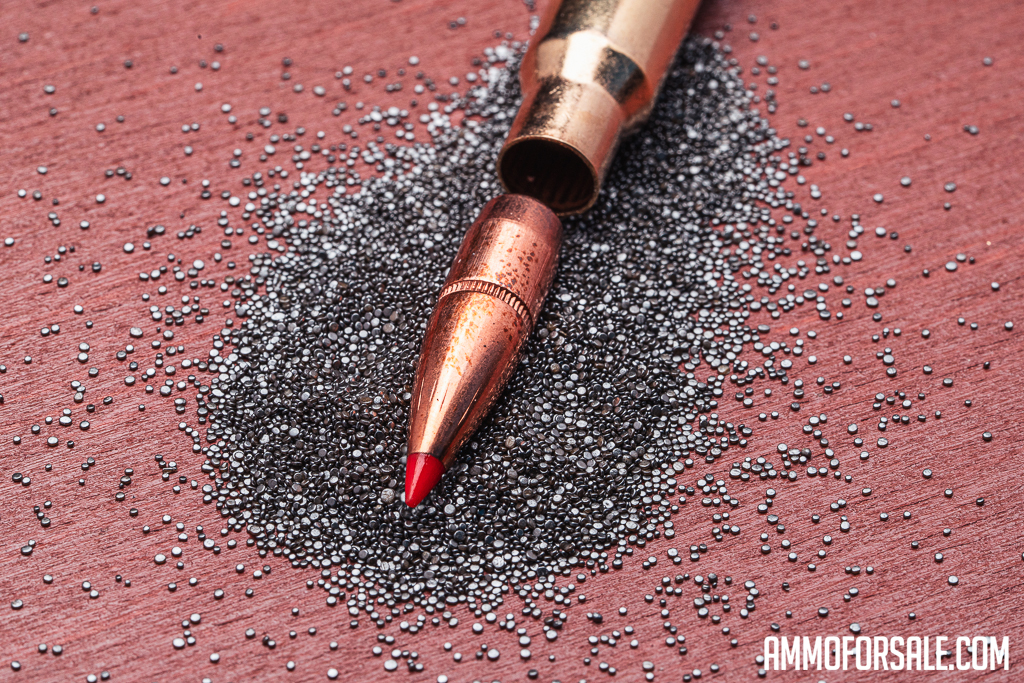 A dissected ammo cartridge showcasing the SST bullet and its boat tail