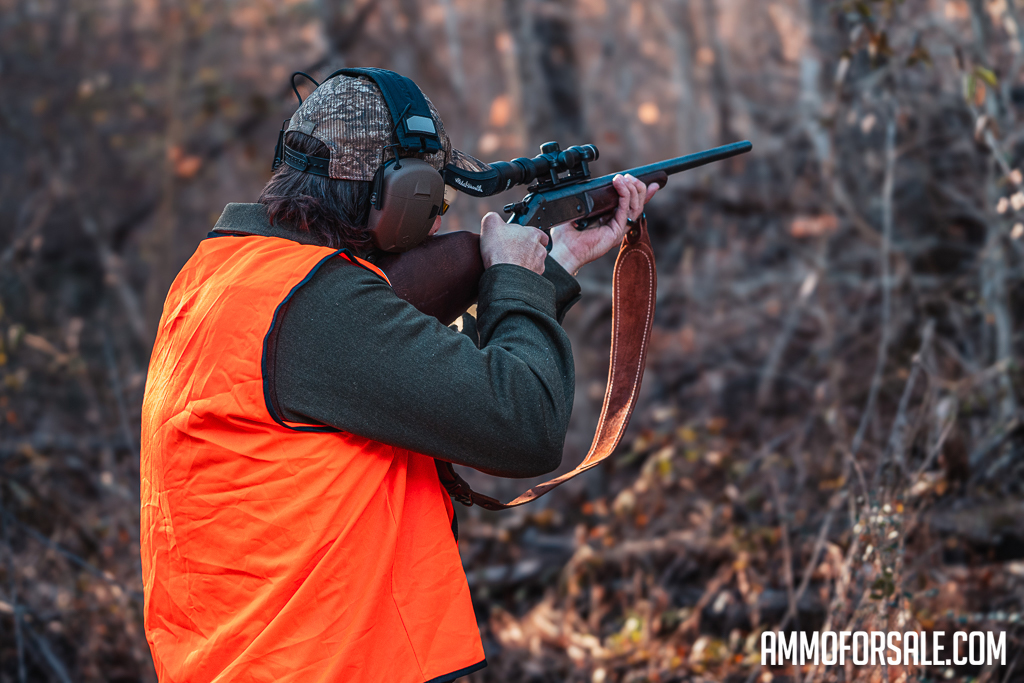 A hunter with a 270 rifle in the woods