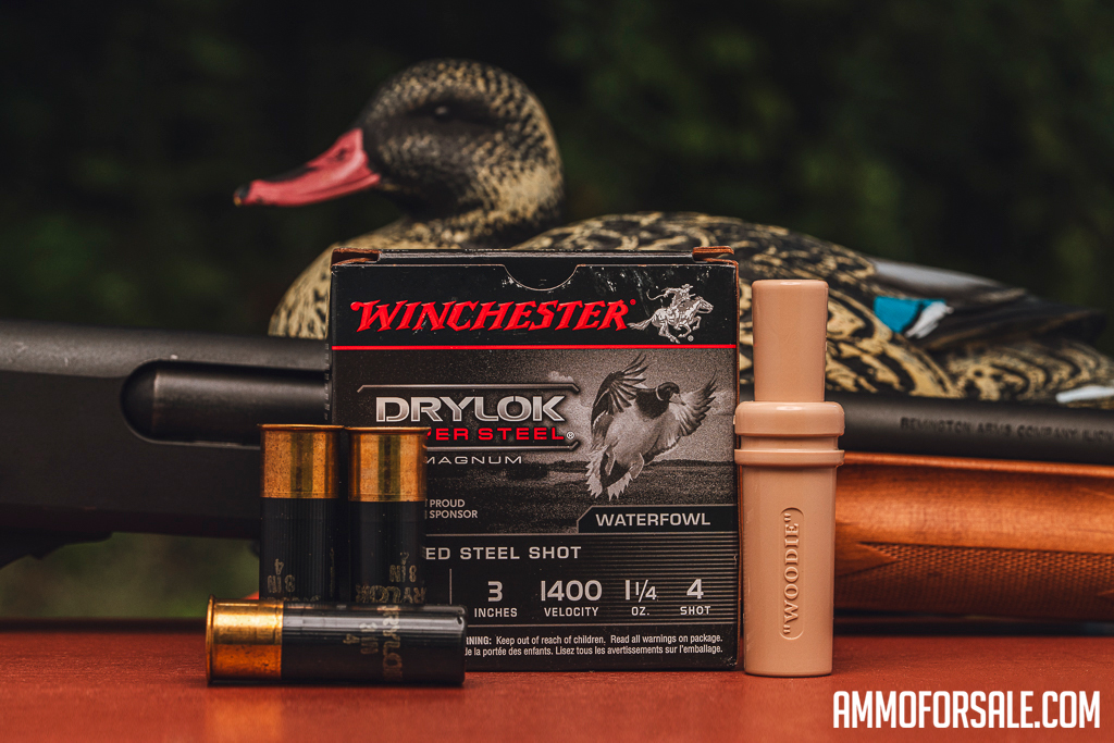 Winchester DryLok 12 gauge ammo with decoy and duck call on display