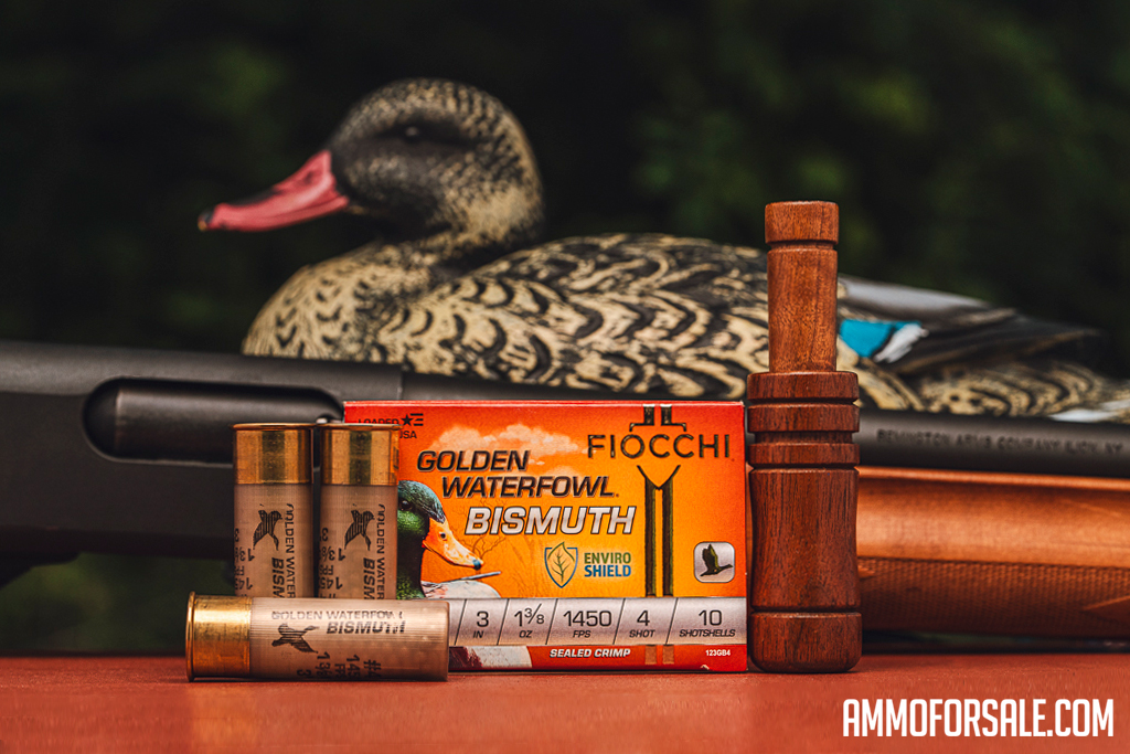 Fiocchi Golden Watefowl 12 gauge ammo displayed with decoy and duck call