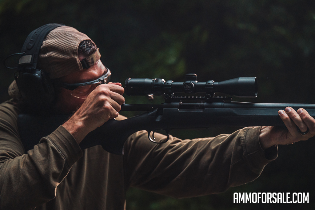 recoil at the range Rifle shooter at the range demonstrating recoil