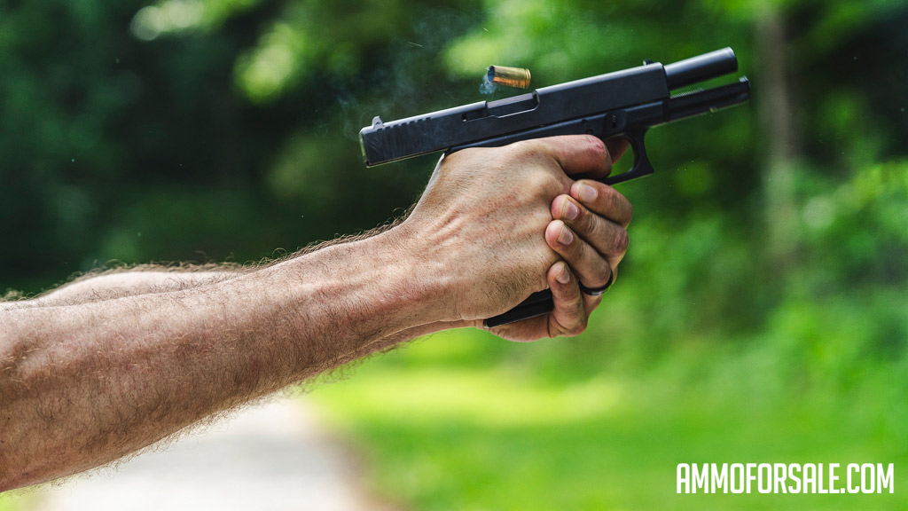 Showing muzzle flip from a 10mm Glock pistol at the shooting range