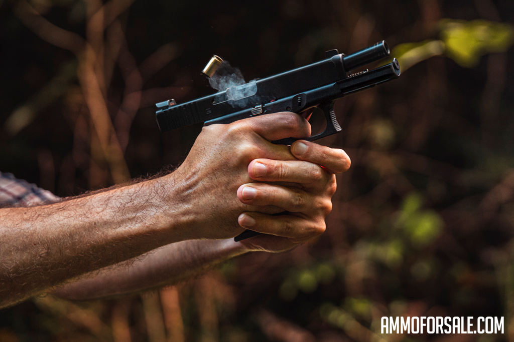 Firing a 9mm pistol at the shooting range