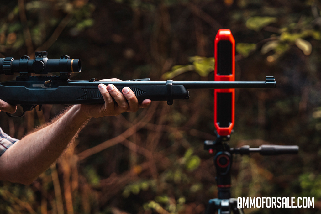 Shooting a 22 WMR rifle at the range with a chronograph to measure ballistics