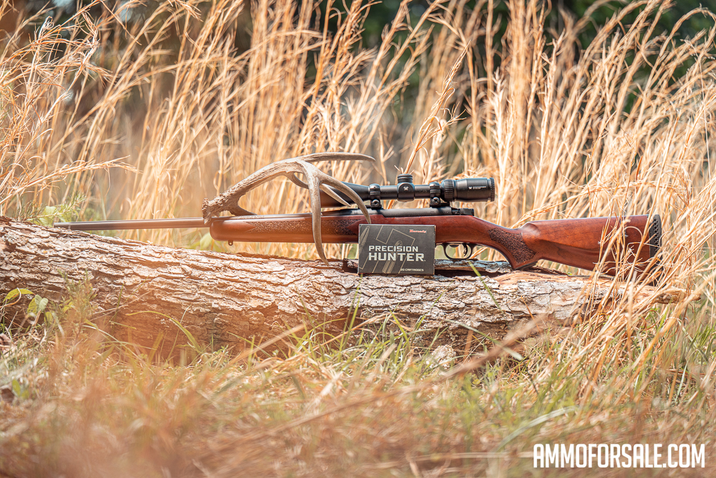 30-06 rifle and ammo on display in a field