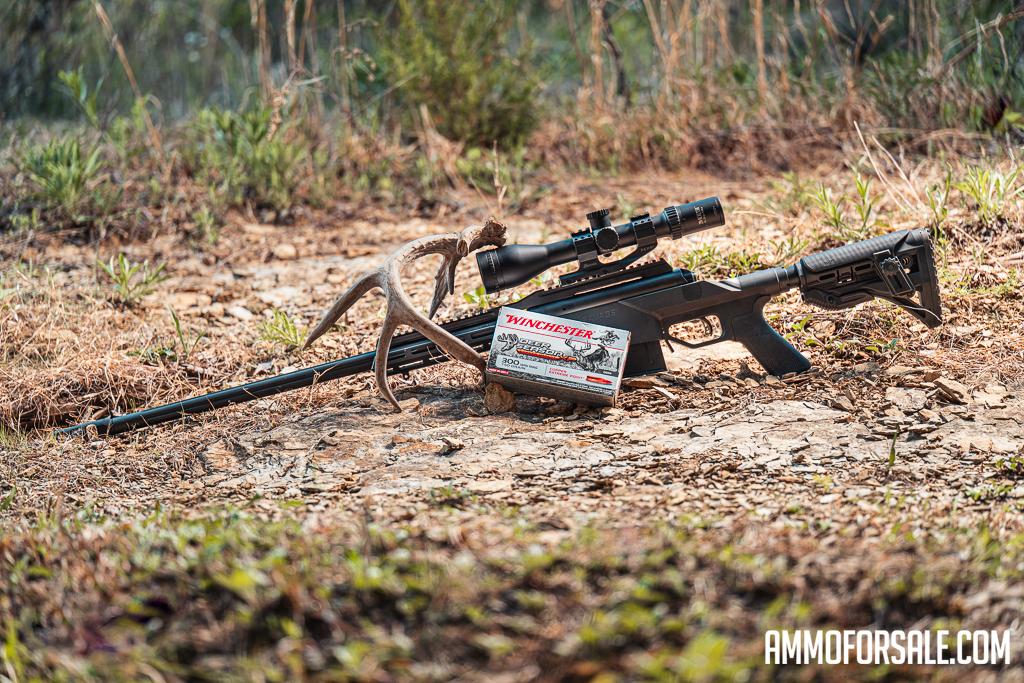 300 Win Mag rifle and ammo on display