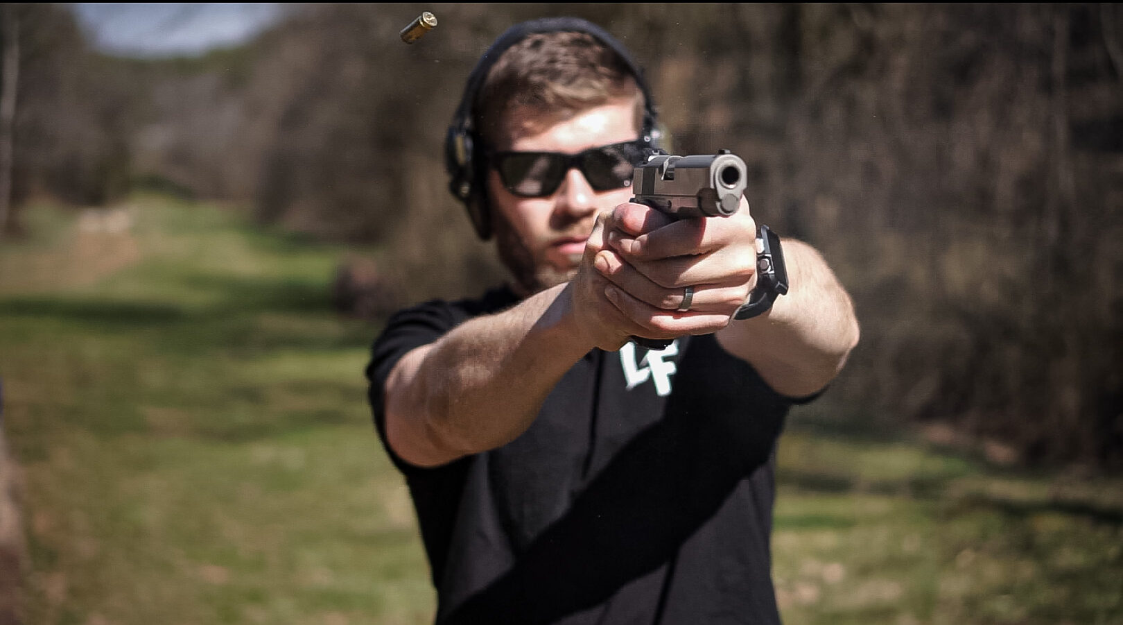 Nolan, the author firing Dan Wesson 1911 Classic as part of his pistol review