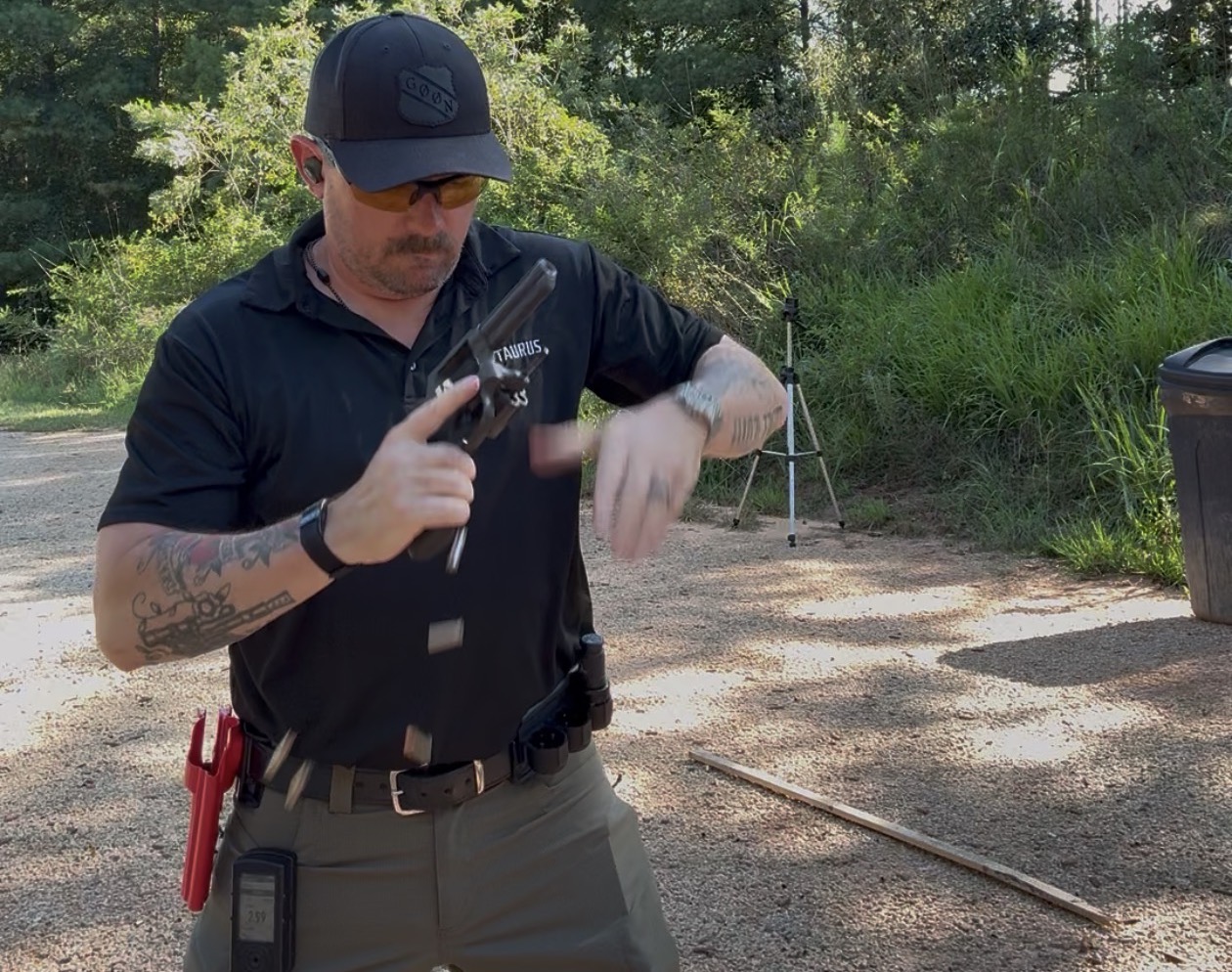 The author, Caleb, reloading while shooting the IDPA 5x5 classifier