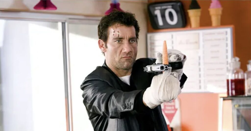 Clive Owen with gun and carrot in Shoot 'Em Up movie