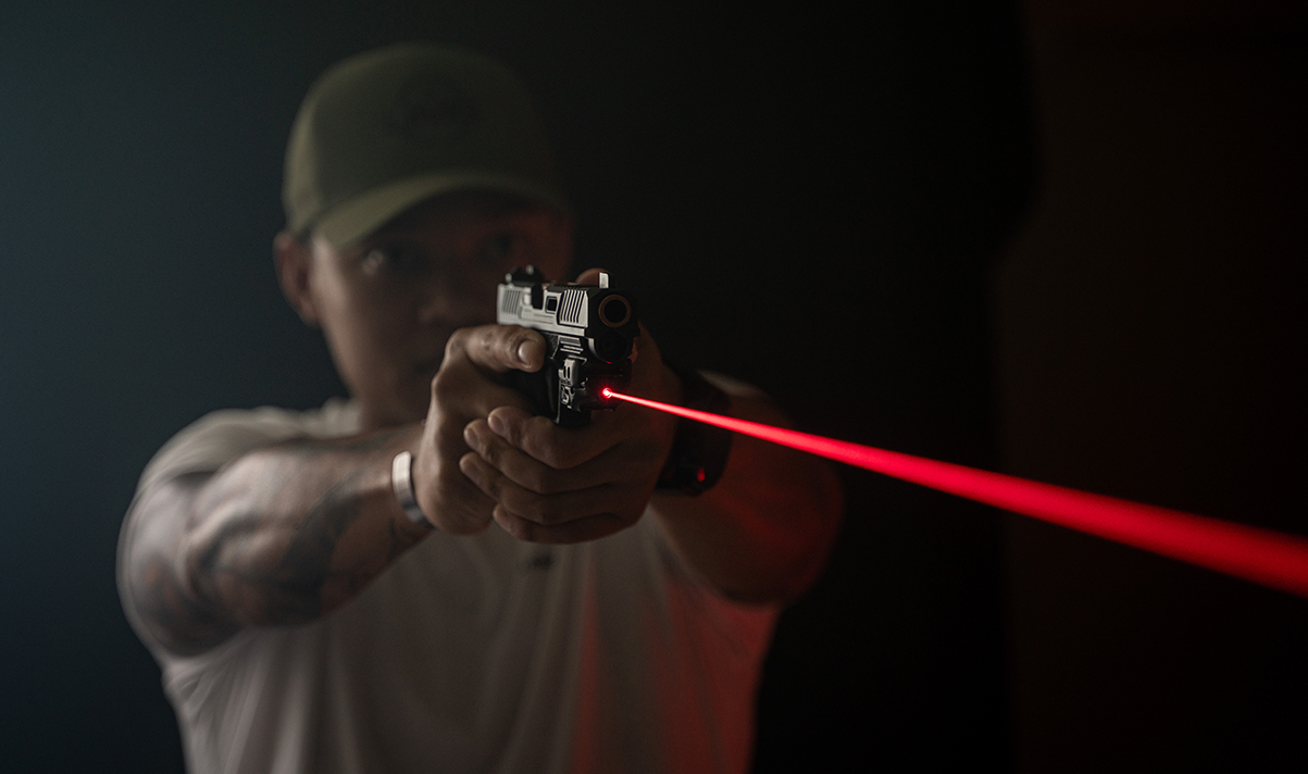 Shooter with red laser sight