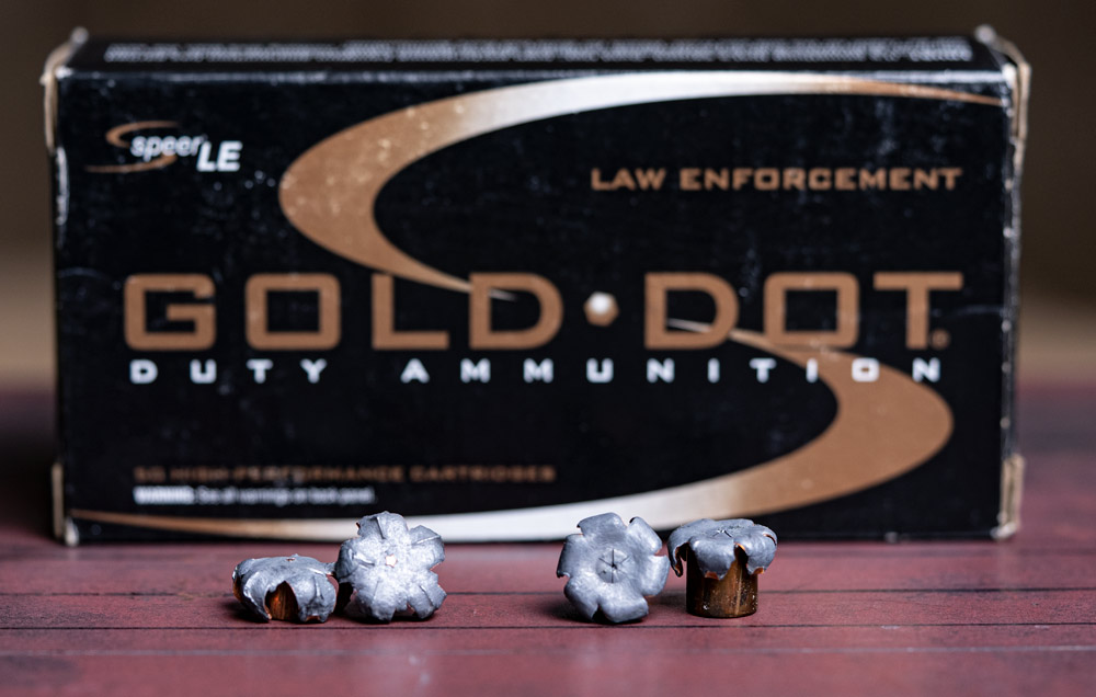 speer gold dot 40 sw vs 357 sig hollow point bullets on table