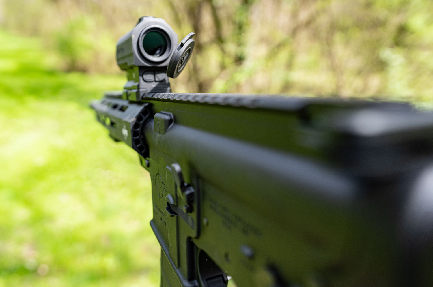 Looking down the barrel of a rifle at a range