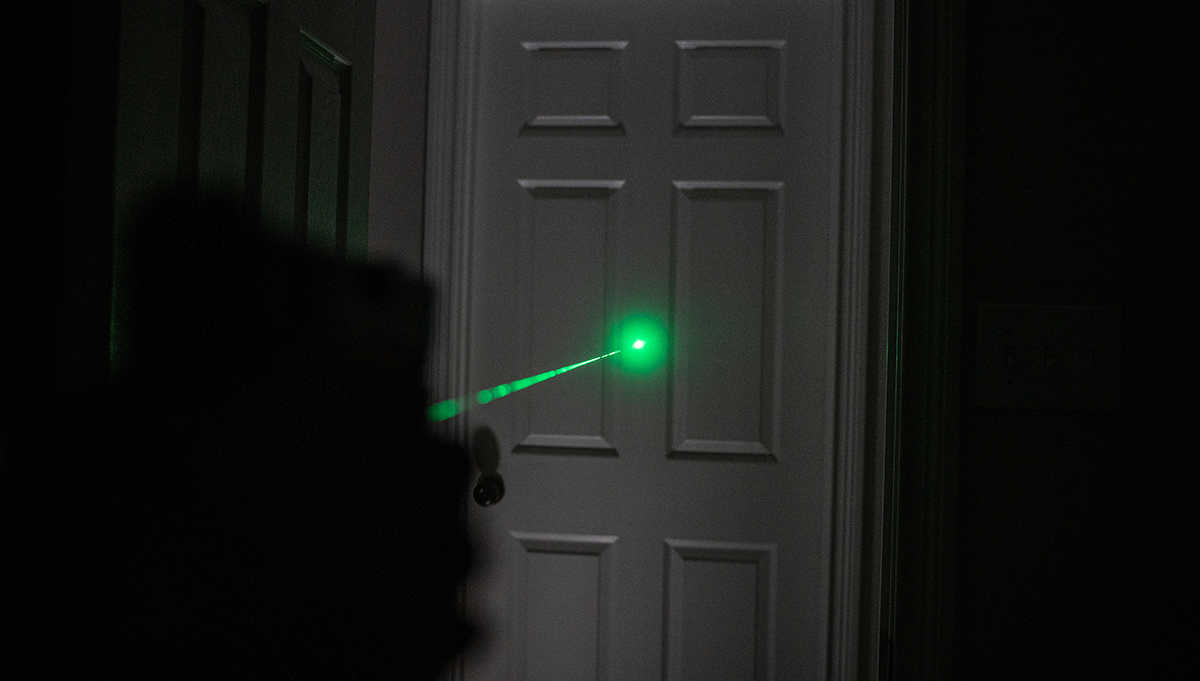 laser sights aimed at door